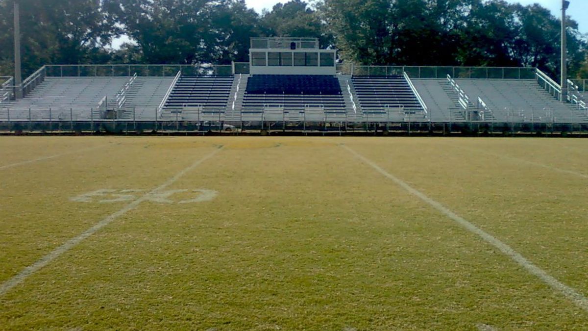 Completed football field and grandstands at a municipal sports complex