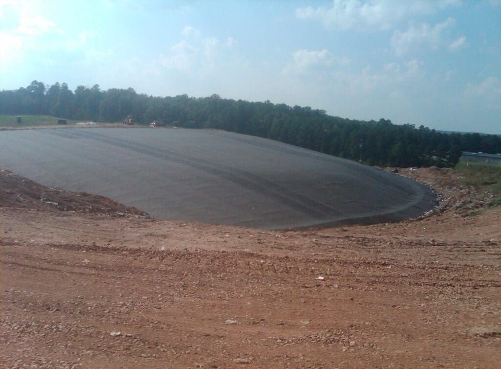 Graded haul road and earthwork at a city landfill construction site