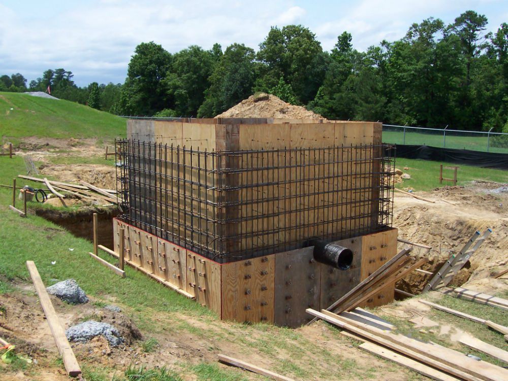 Building wrapped in scaffolding during concrete work