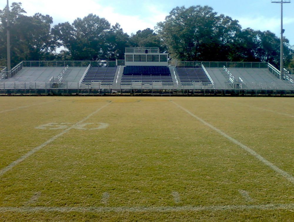 Completed football field and grandstands at a municipal sports complex