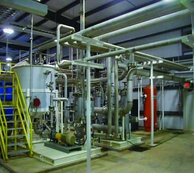 Process piping and valves inside an industrial building