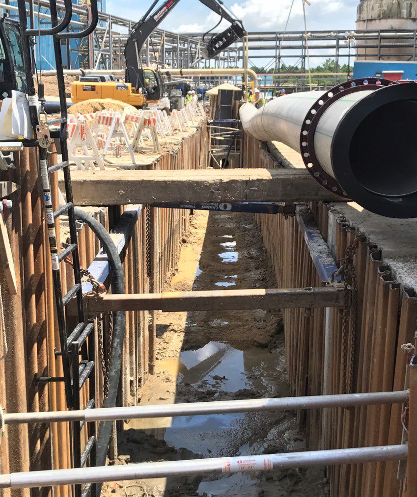 Process sewer pipe staged on timber supports before installation
