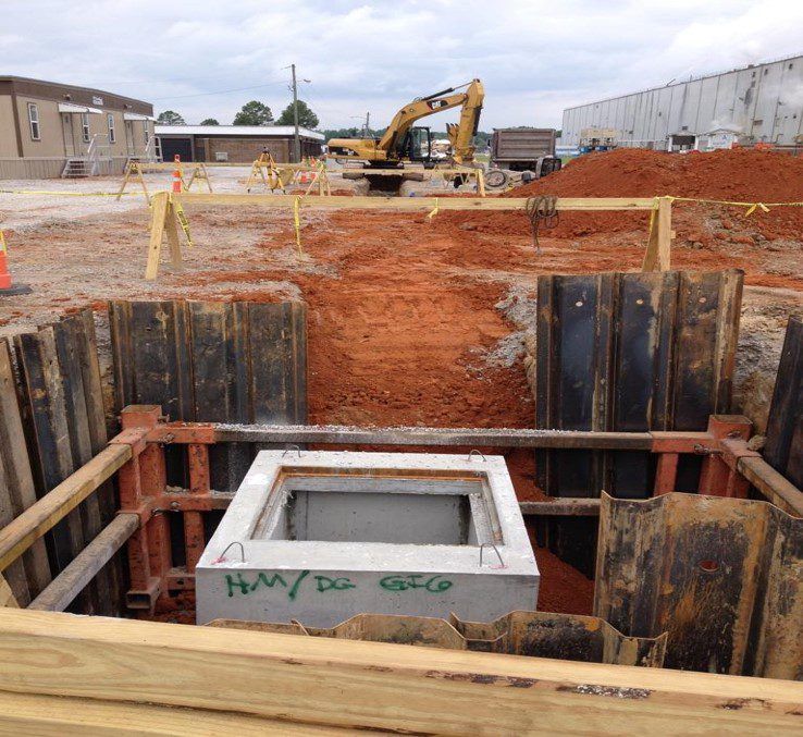 Large concrete structure and piping at an underground utility installation